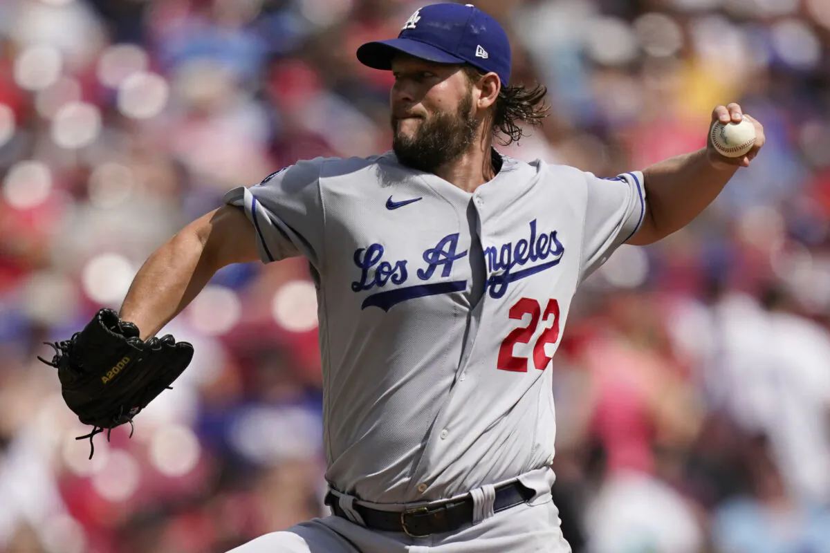 Los Angeles Dodgers starting pitcher Clayton Kershaw (22) delivers during the first inning of a baseball game against the Cincinnati Reds in Cincinnati on Sept 19, 2021. (AP Photo/Bryan Woolston)