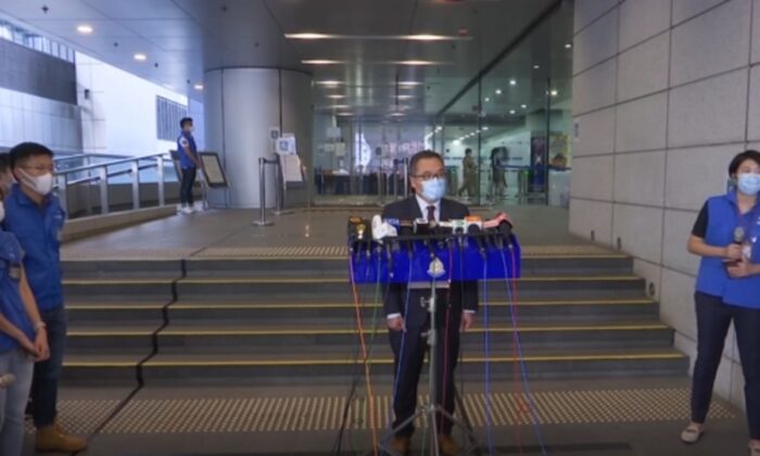 In the screenshot of this video, Li Kwai-wah, Senior Supervisor of the National Security Agency, is hosting a press conference on a student group police arrest in Hong Kong on September 20, 2021.  (AP via NTD)
