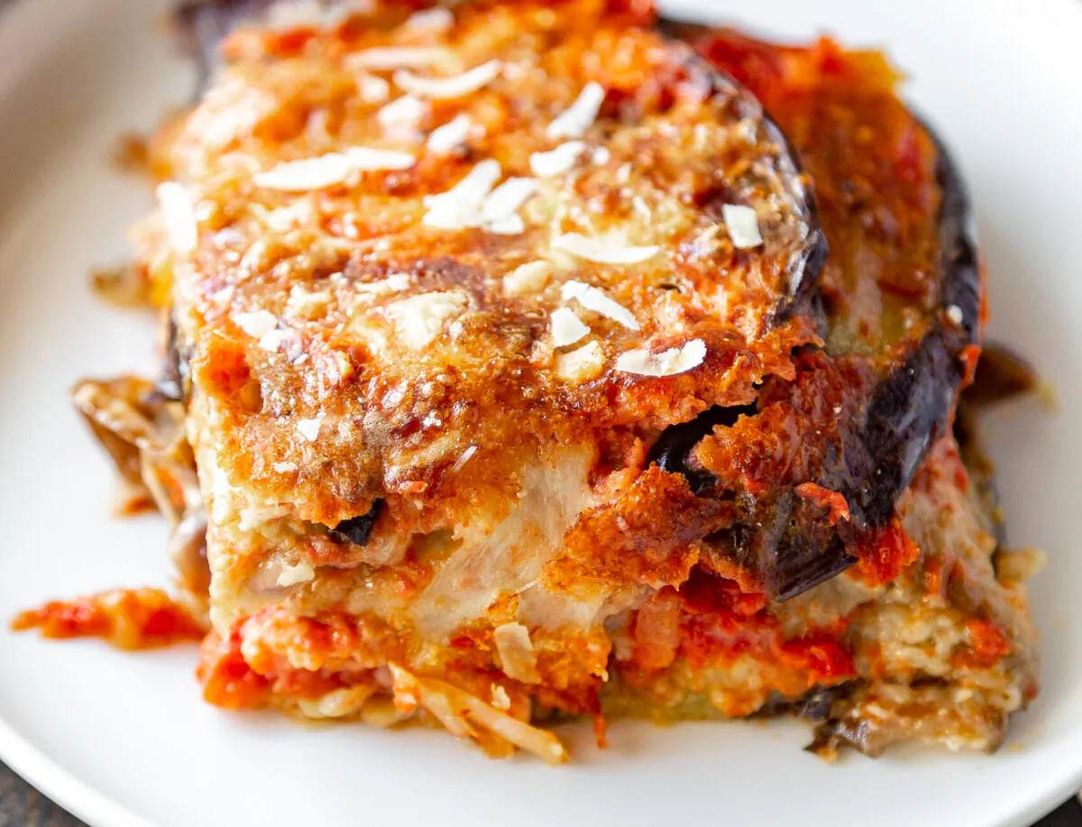 The beauty is in the layers: silky fried eggplants, a simple tomato sauce, and plenty of cheese—and a secret ingredient for extra richness. (Giulia Scarpaleggia)