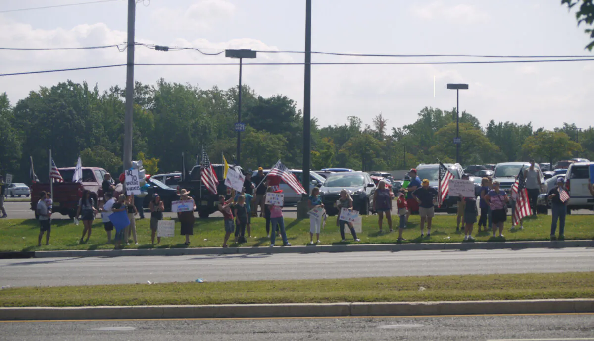 People rally against COVID-19 vaccine mandates and to protect their constitutional rights in Deptford, N.J., on Sept. 18, 2021. (Ella Kietlinska/The Epoch Times)