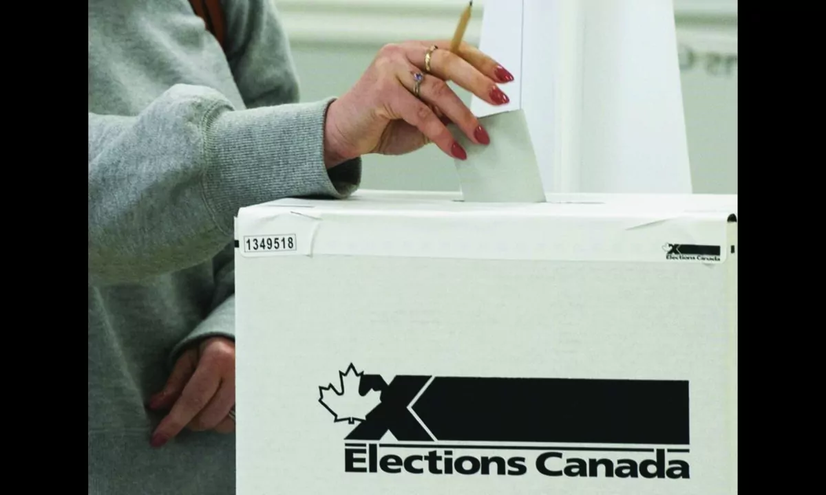 A voter casts their ballot in the advance polls, on September 10, 2021  in Chambly, Que. Canadians will vote in a federal election Sept. 20th. (The Canadian Press/Ryan Remiorz)