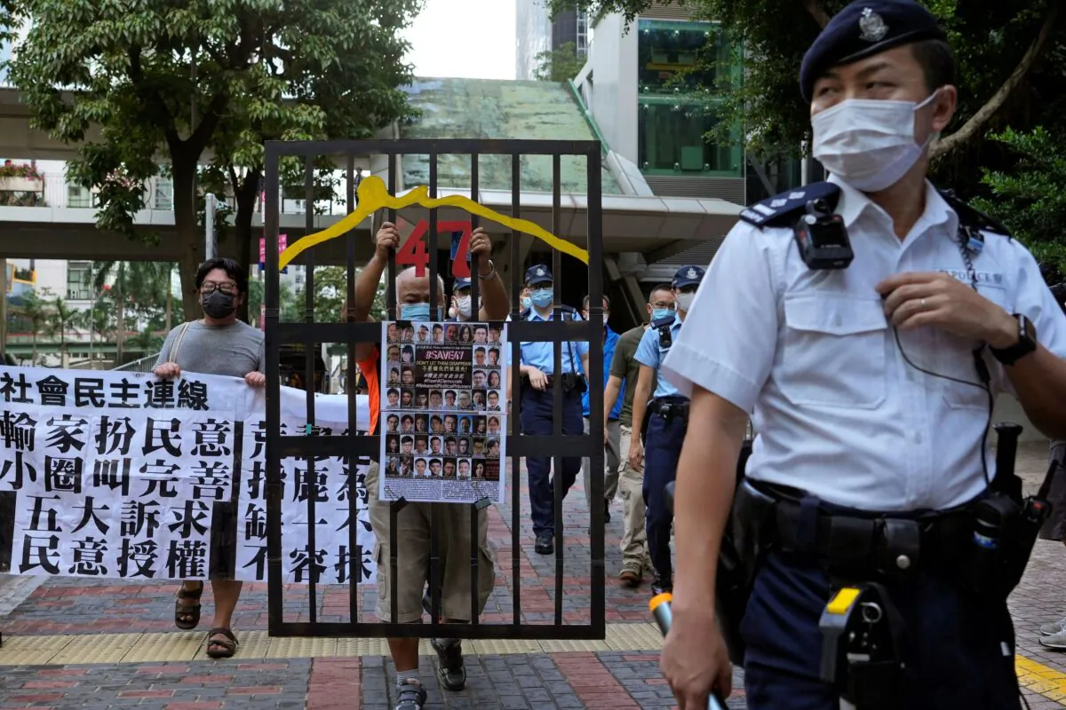 A police officer guard at a street during a protest against an election committee that will vote for the city's leader in Hong Kong on Sept. 19, 2021. (Vincent Yu/AP Photo)