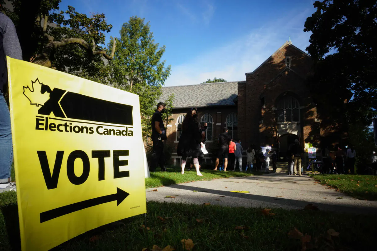 People start to line up early for the Canadian general election before polls open in west-end Toronto on Sept. 20, 2021. (The Canadian Press/Graeme Roy)