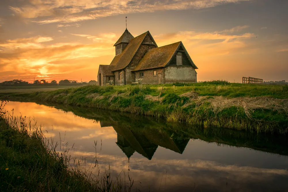 St. Thomas Becket, which dates to the 13th century, in Fairfield is arguably the most iconic of Romney Marsh churches. (Sixpixx/Shutterstock)