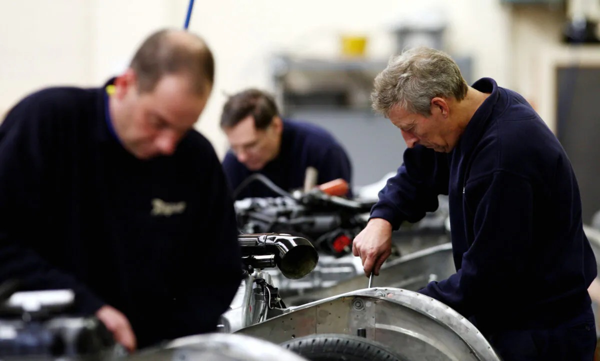 UK workers in a factory, in a file photo dated Nov. 19, 2008. (David Davies/PA)
