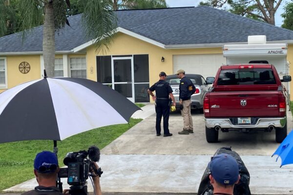 Law enforcement officials investigate home of Brian Laundrie wanted for questioning in the disappearance of his girlfriend, Gabby Petito, in North Port, Fla., on Sept. 20, 2021. (Curt Anderson/AP Photo)