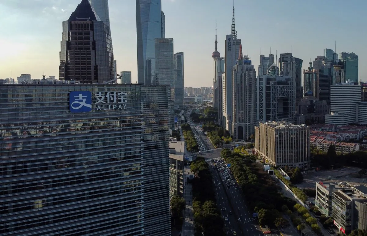 This aerial photo shows the logo (L) of China's pioneering digital payments firm Alipay on the office block of its parent company Ant Group in Shanghai on Nov. 4, 2020. (Hector Retamal/AFP via Getty Images)