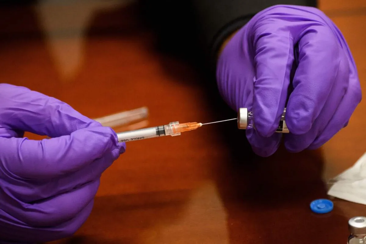 A COVID-19 vaccine. (Patrick T. Fallon/AFP via Getty Images)