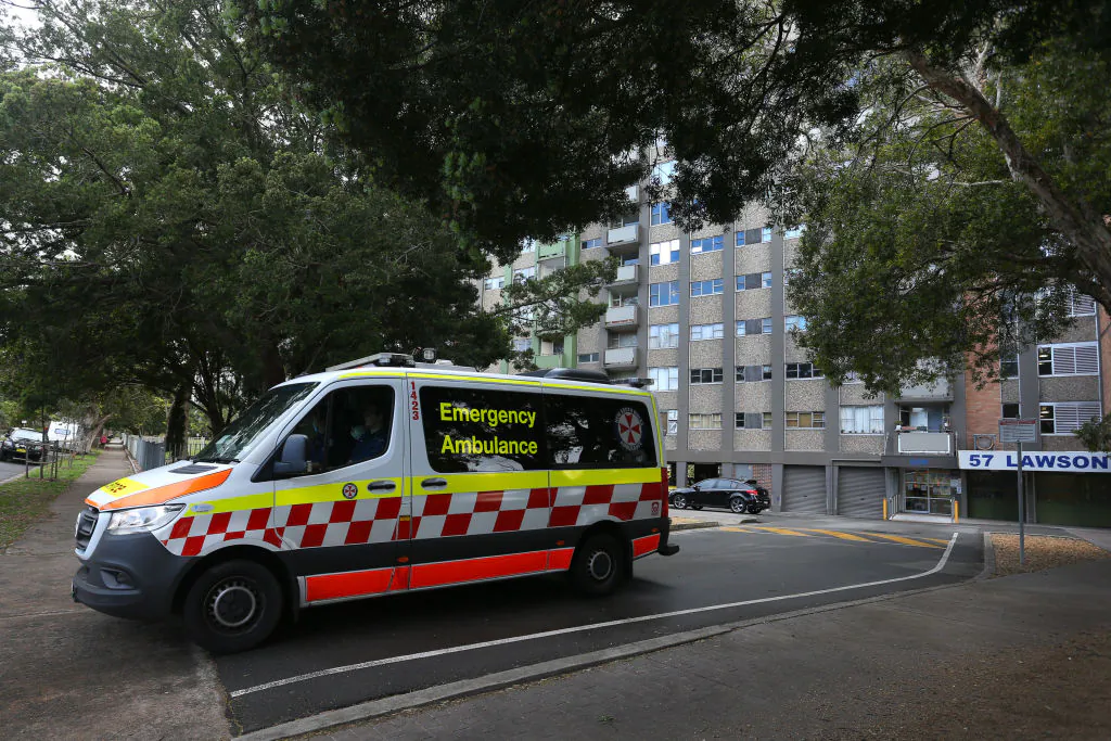 A NSW ambulance is seen departing a housing tower on Morehead Street in Redfern, Sydney, Australia, on Sept. 16, 2021. (Lisa Maree Williams/Getty Images)