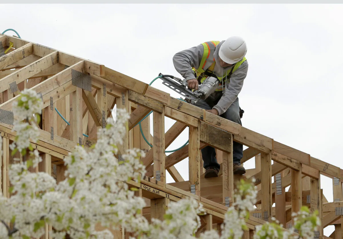 Work is being done on an apartment building under construction in Sacramento, Calif., in a file photo. (Rich Pedroncelli, File/AP Photo)