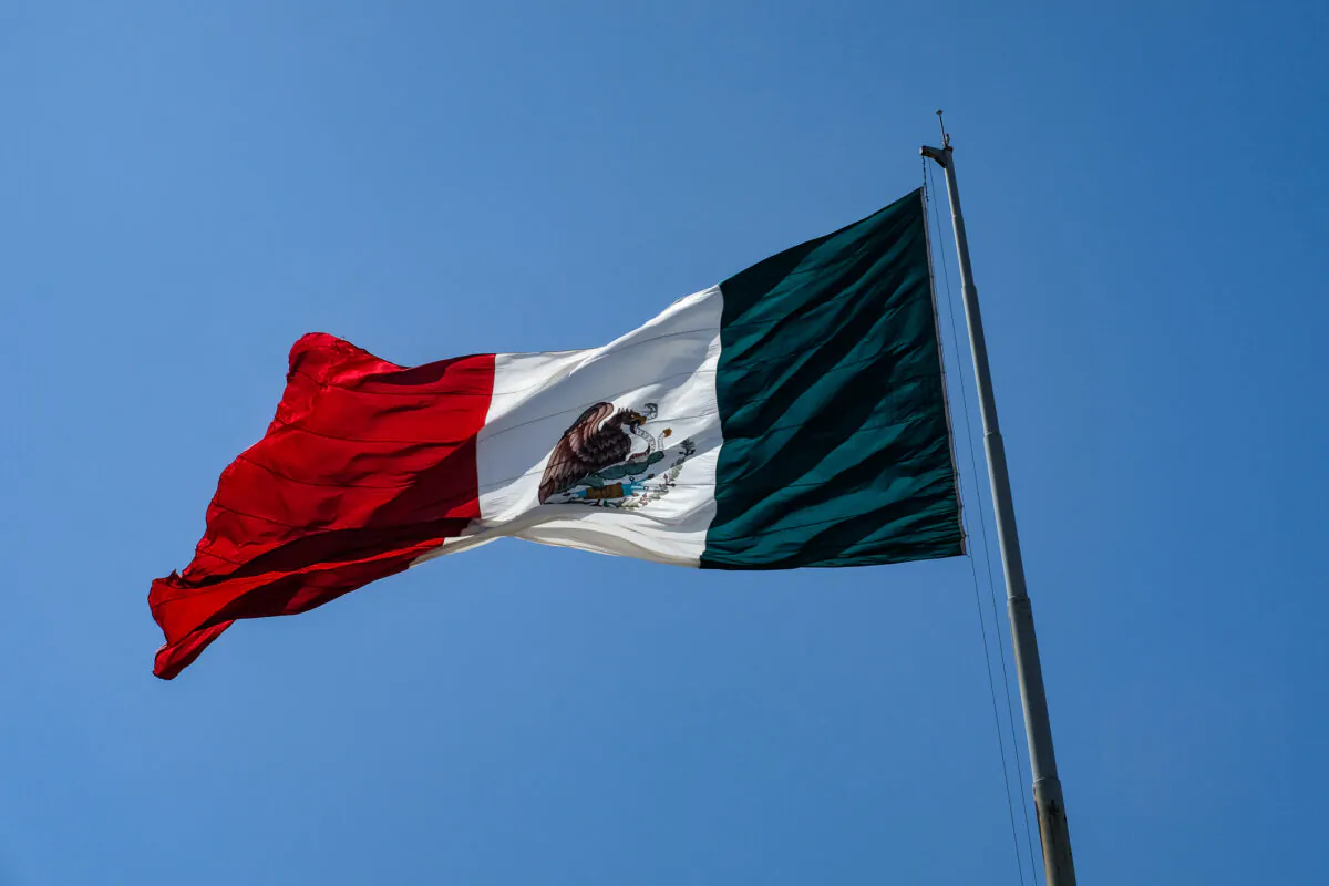 A Mexican flag near the San Ysidro border entry area of Tijuana, Mexico, on Sept. 10, 2021. (John Fredricks/The Epoch Times)