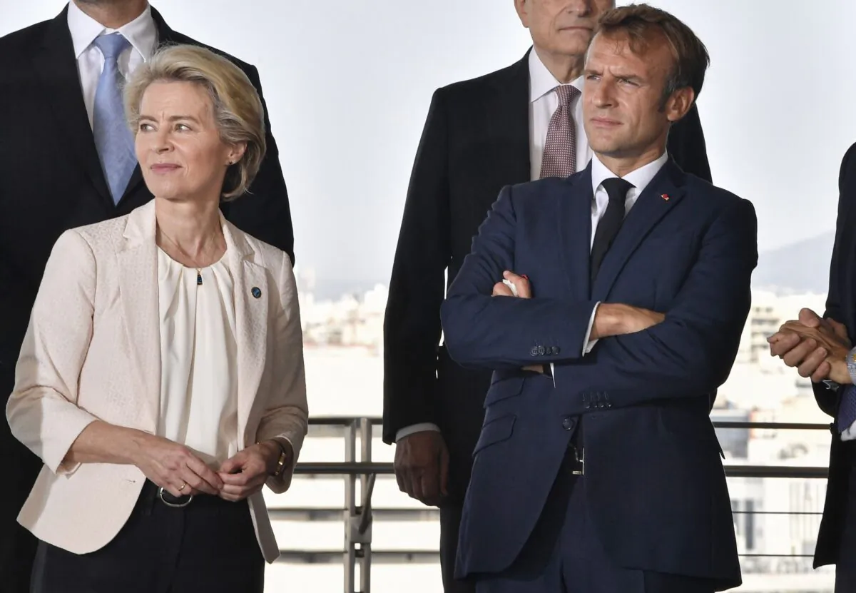 French President Emmanuel Macron (R) and European Commission President Ursula von der Leyen look at the view during the 8th MED7 Mediterranean countries summit at the Stavros Niarchos cultural center in Athens, on Sept. 17, 2021. (Louisa Gouliamaki/AFP via Getty Images)