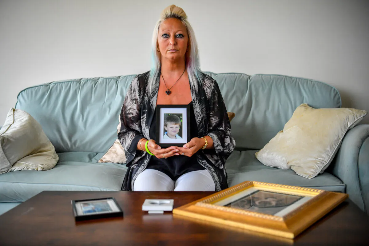 Charlotte Charles, mother of Harry Dunn, holding a photograph of him aged 14, who has marked the anniversary of her son's death by saying his name is forever written into history and vowed to carry on his family's fight for justice, in an undated file photo. (Family Handout/PA)