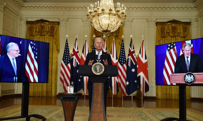 U.S. President Joe Biden participates in a virtual press conference on national security with British Prime Minister Boris Johnson (R) and Australian Prime Minister Scott Morrison at the White House in Washington, D.C., on Sept. 15, 2021. The three leaders announced the AUKUS defence partnership between their countries. (Brendan Smialkowski/AFP via Getty Images)