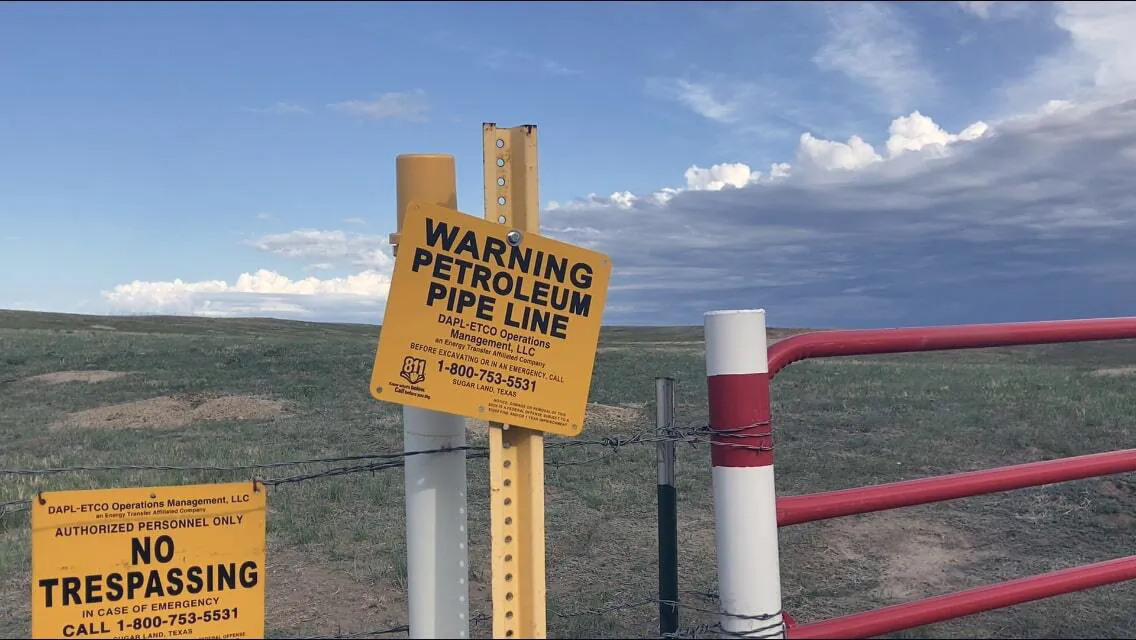 Signs marking the Dakota Access Pipeline are posted north of Cannonball, N.D., and the Standing Rock Reservation on May 20, 2021. (Matthew Brown/AP Photo, File)