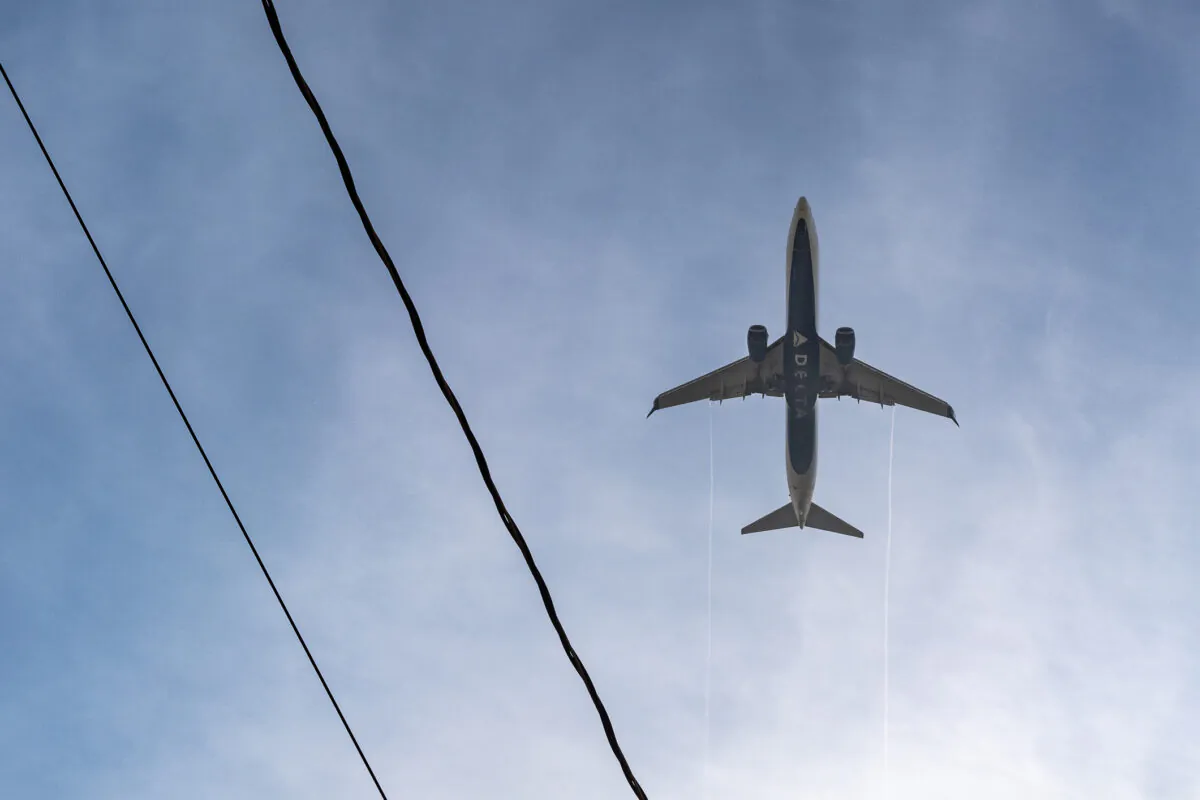 Delta Airlines aircraft lands in Los Angeles International Airport in Los Angeles on May 1, 2021. (John Fredricks/The Epoch Times)