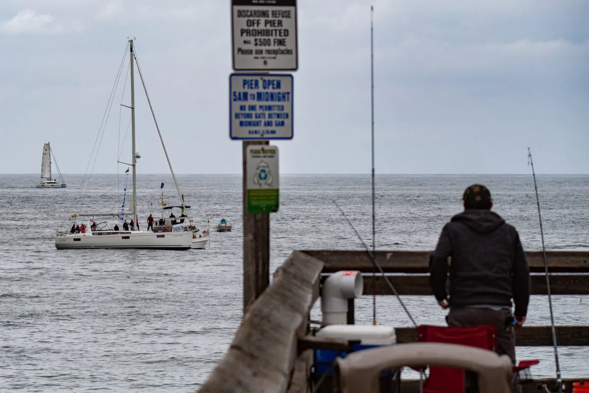 Boats partake in the 73rd Newport Beach to Ensenada Boat Race, in Newport Beach, Calif., on April 23, 2021. (John Fredricks/The Epoch Times)