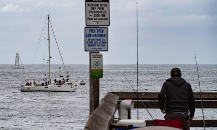 Boats partake in the 73rd Newport Beach to Ensenada Boat Race, in Newport Beach, Calif., on April 23, 2021. (John Fredricks/The Epoch Times)