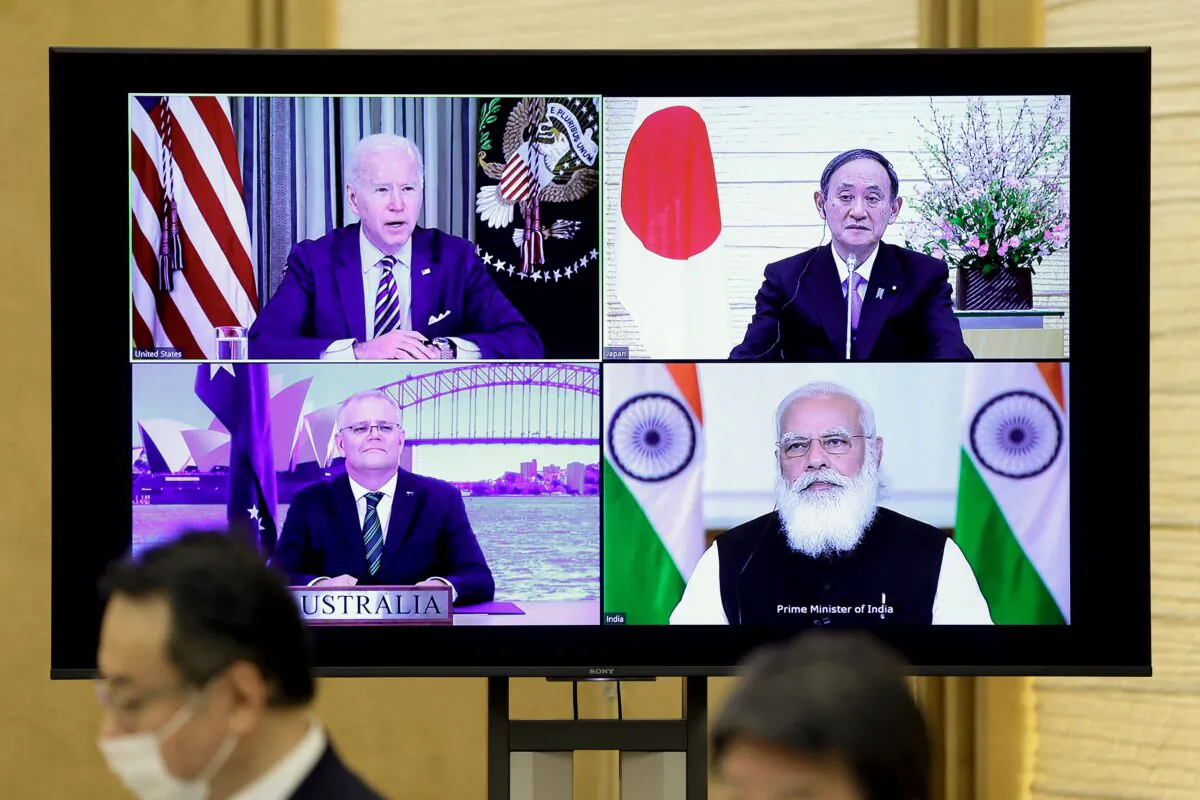 A monitor displaying a virtual meeting with U.S. President Joe Biden (top L), Australia's Prime Minister Scott Morrison (bottom L), Japan's Prime Minister Yoshihide Suga (top R), and India's Prime Minister Narendra Modi is seen during the virtual Quadrilateral Security Dialogue (Quad) meeting, at Suga's official residence in Tokyo, on March 12, 2021. (Kiyoshi Ota / POOL / AFP)