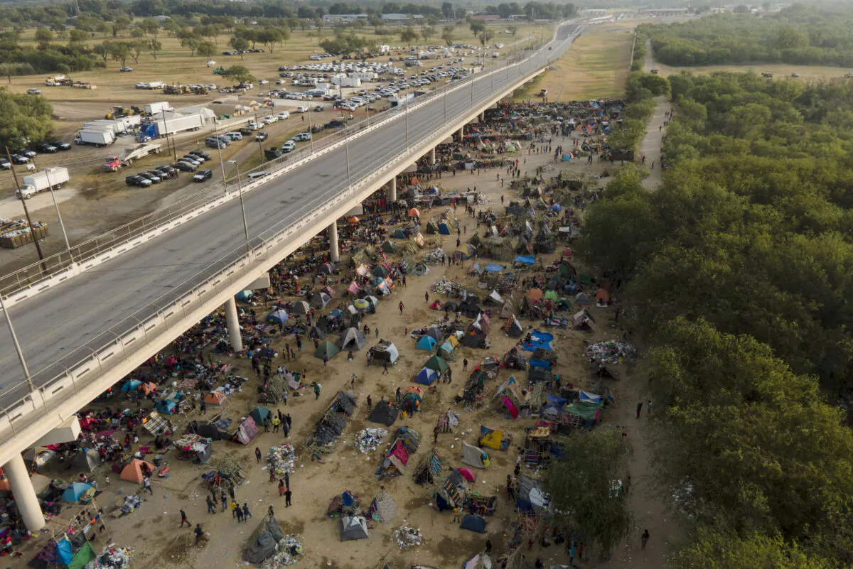 Illegal immigrants, many from Haiti, are seen at an encampment along the Del Rio International Bridge near the Rio Grande in Del Rio, Texas, on Sept. 21, 2021. (Julio Cortez/AP Photo)