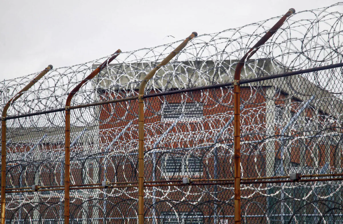 A barbed wire fence outside inmate housing on New York's Rikers Island correctional facility in New York on March 16, 2011. (Bebeto Matthews/AP Photo, File)