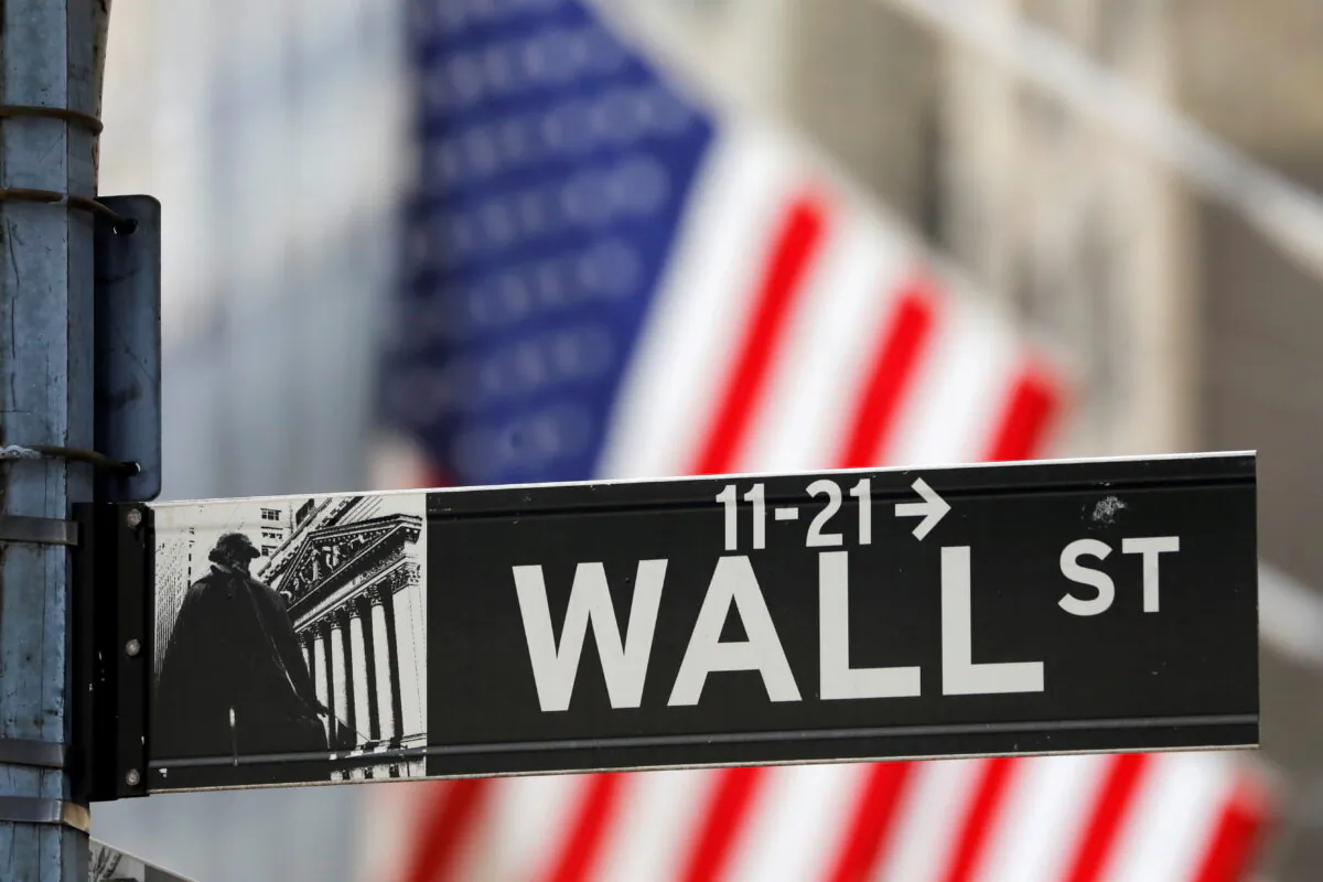 A street sign for Wall Street is seen outside the New York Stock Exchange (NYSE) in New York City, on July 19, 2021. (Andrew Kelly/Reuters)