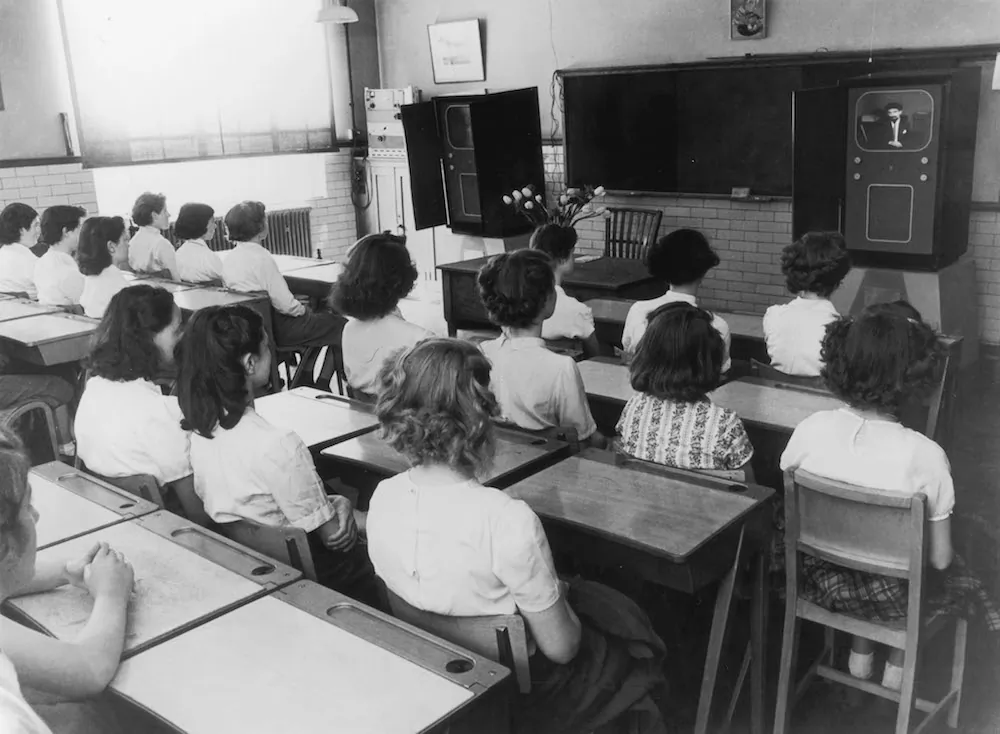Early years in school were spent in sparse wooden desks. Note the small hole to hold your ink bottle and grooved space for pencil or pen. (FPG/Hulton Archive/Getty Images)