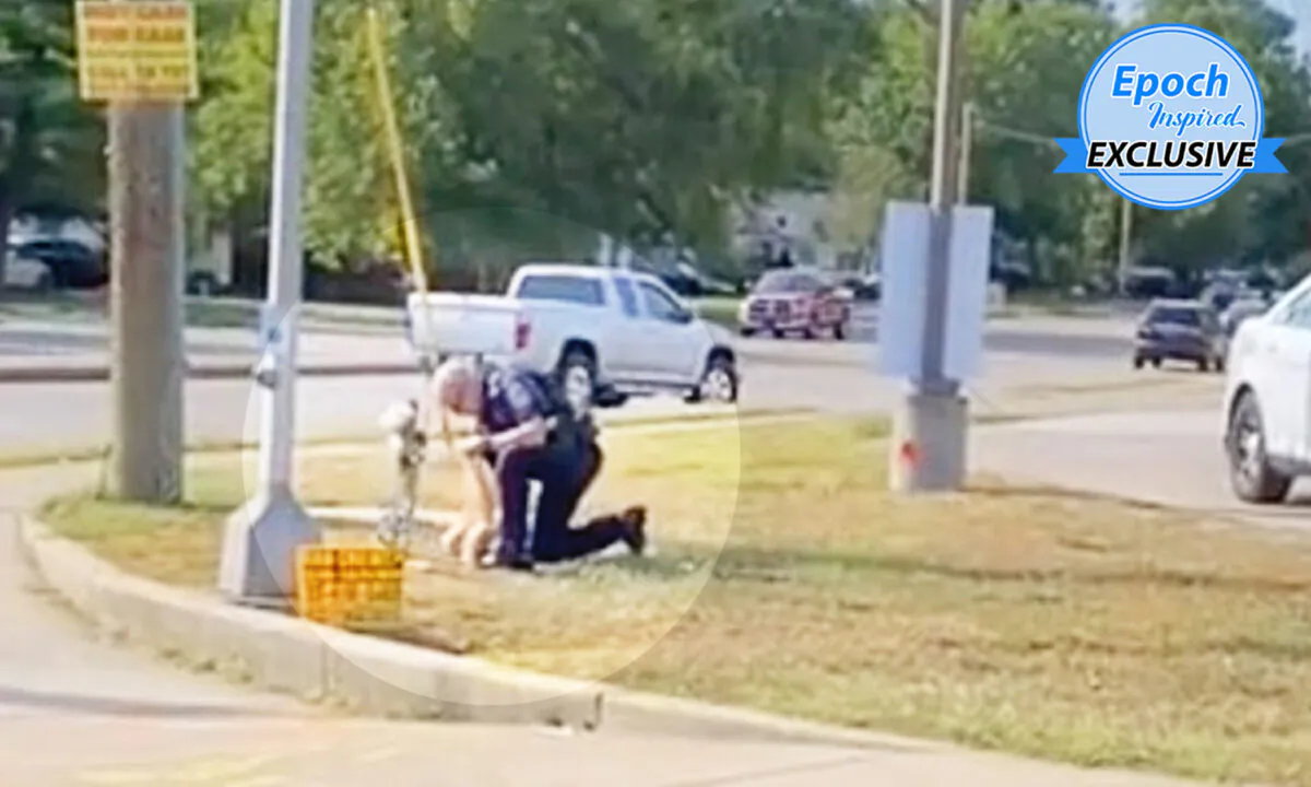 Officer Jeff Stagg picking up trash from the memorial site of a crash victim at the intersection of Rockville Road and Lyndhurst Drive, Indianapolis. (Courtesy of Kaleb Hall)