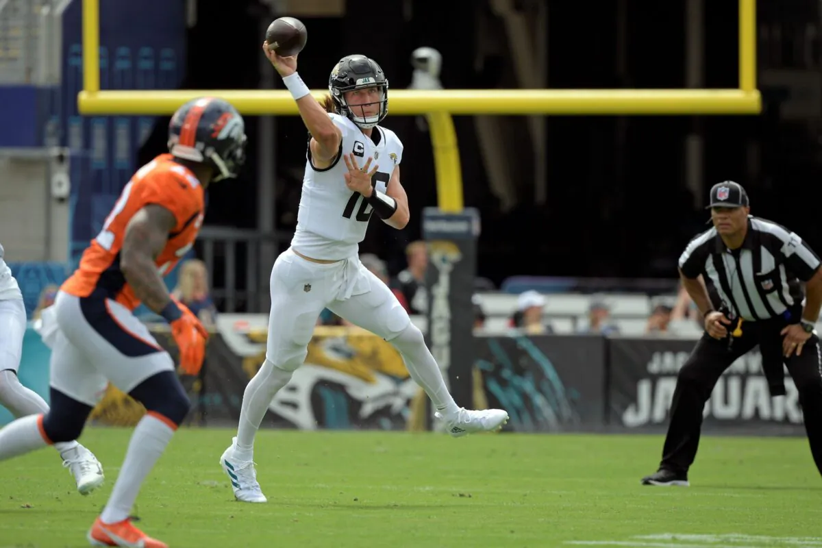 Jacksonville Jaguars quarterback Trevor Lawrence (R) throws a pass against the Denver Broncos during the first half of an NFL football game, in Jacksonville, Fla., on Sept. 19, 2021. (Phelan M. Ebenhack/AP Photo)
