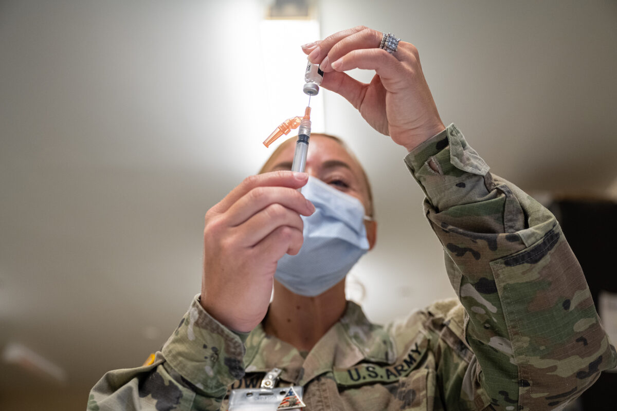 A technician fills a syringe with a Janssen COVID-19 vaccine in Fort Knox, Kentucky, on Sept. 9, 2021. (Jon Cherry/Getty Images)