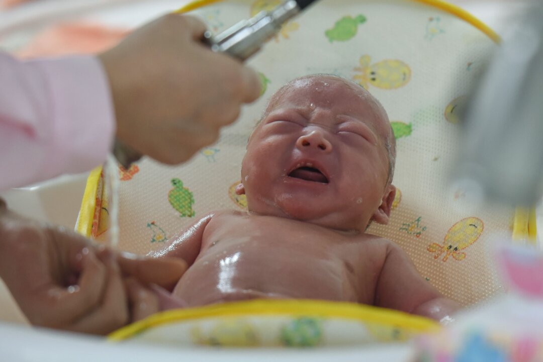 A medical staff taking care of a new born baby at a hospital in Fuyang in China's eastern Anhui province on Jan. 19, 2019.  China's population shrank last year for the first time in 70 years, experts said, warning of a 'demographic crisis' that puts pressure on the country's slowing economy. (STR/AFP via Getty Images)