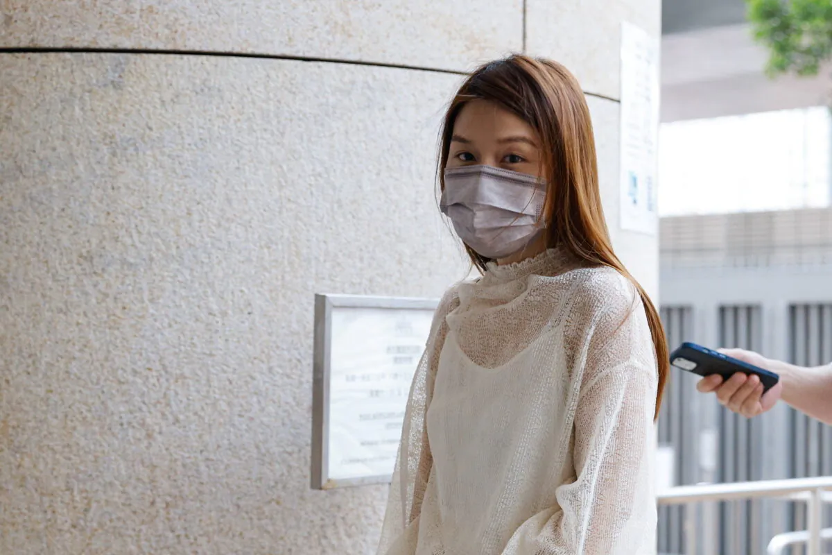 Pro-democracy activist Clarisse Yeung Suet-ying, one of the 47 pro-democracy activists charged with conspiracy to commit subversion under the national security law, arrives at West Kowloon Magistrates's Courts building, in Hong Kong, on Sept. 23, 2021. (Tyrone Siu/Reuters)