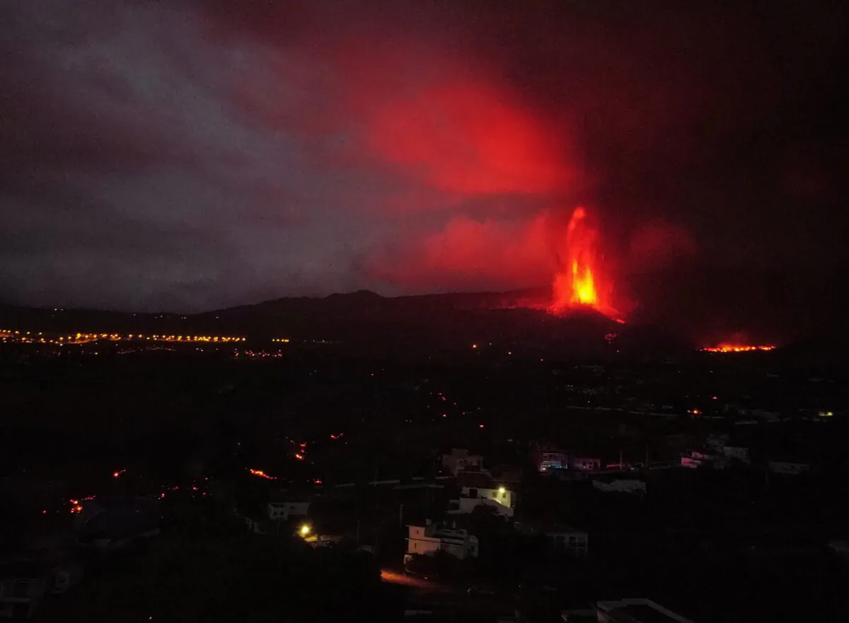 Lava and smoke rise following the eruption of a volcano in Los Llanos de Aridane on the Canary Island of La Palma, Spain, on Sept. 22, 2021. (Nacho Doce/Reuters)