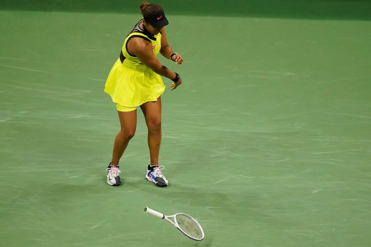 Naomi Osaka of Japan throws her racket down during a match against Leylah Fernandez of Canada at the third round of the U.S. Open tennis championships in New York,  Sept. 3, 2021. (Frank Franklin II/AP)