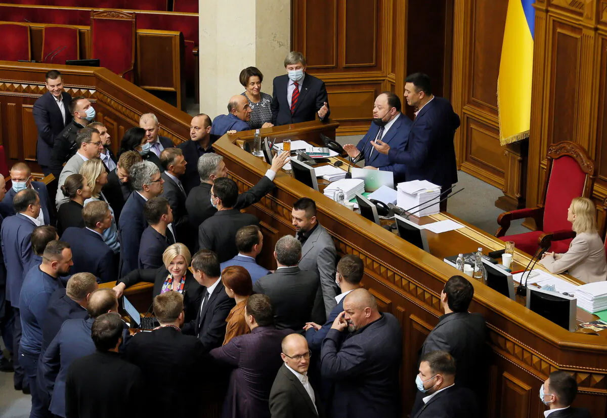 Opposition lawmakers argue with the first deputy parliament speaker Ruslan Stefanchuk during a parliament session to vote for a law that order "oligarchs" to register and stay out of politics, in Kyiv, Ukraine, on Sept. 23, 2021. (Ruslan Kaniuka/Reuters)