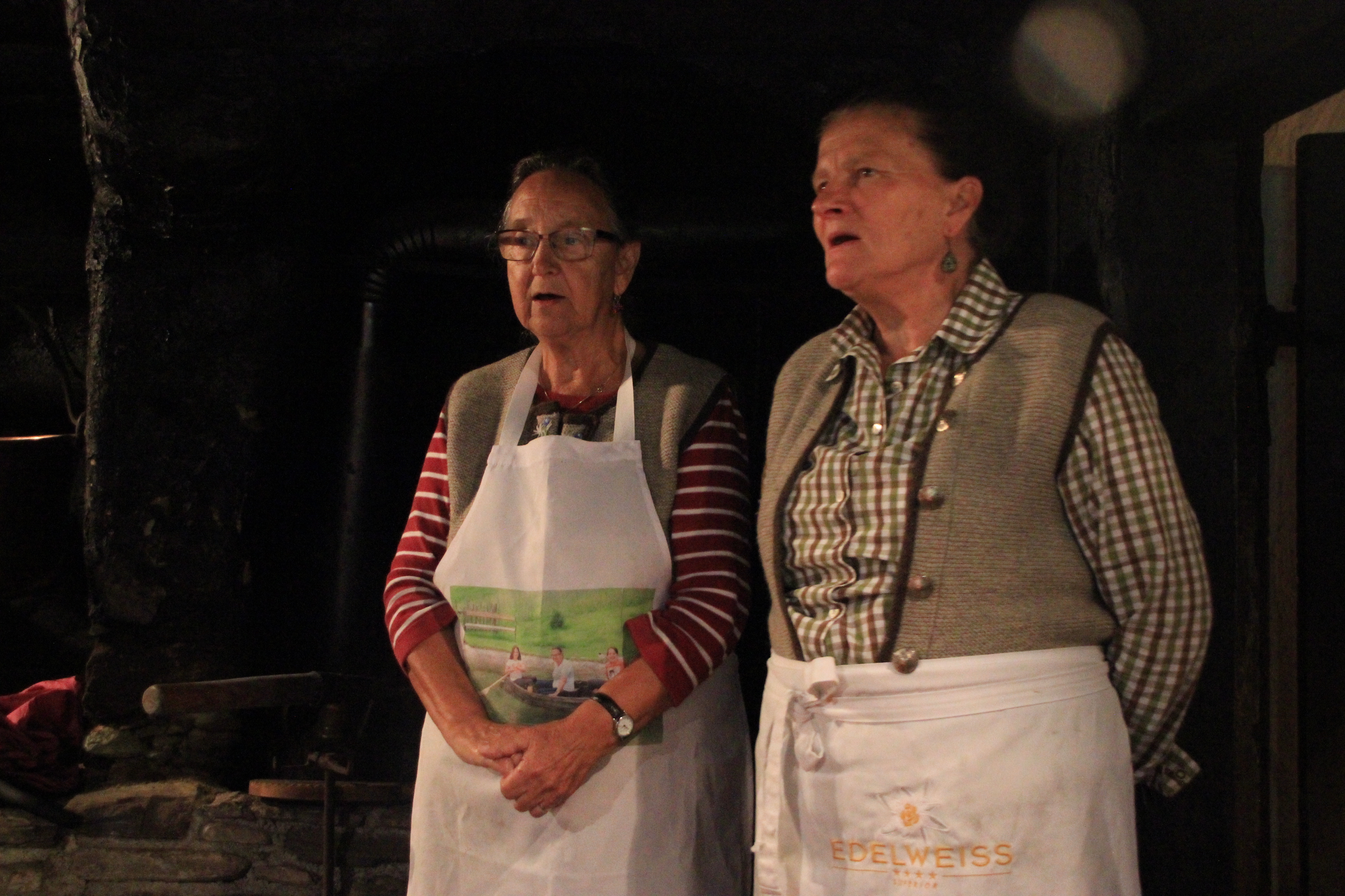 elderly ladies sining in the soot covered Rauchkuchl copyright Wibke Carter