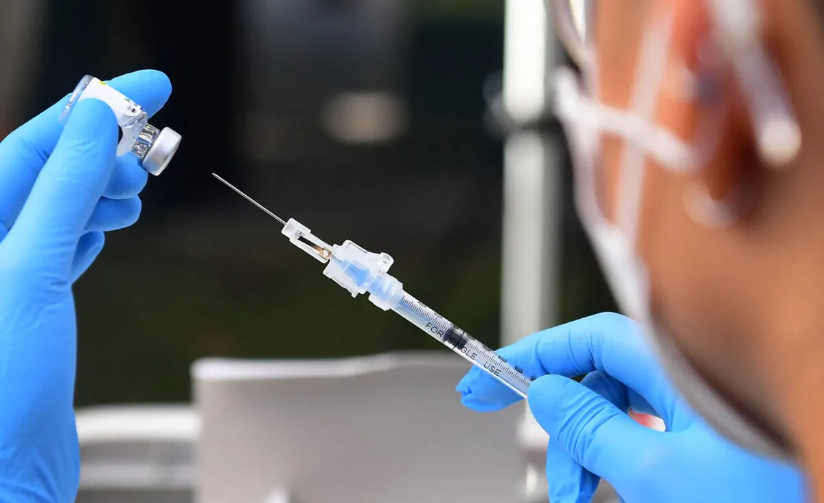 The Pfizer-BioNTech COVID-19 vaccine is prepared for administration at a vaccination clinic on Sept. 22, 2021. (Frederic J. Brown/AFP via Getty Images)