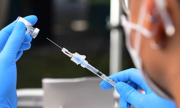 The Pfizer COVID-19 vaccine is prepared for administration at a vaccination clinic on Sept. 22, 2021. (Frederic J. Brown/AFP via Getty Images)
