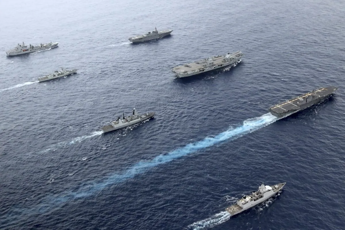 The Japanese JS Izumo (R) with other naval vessels, including those from the United Kingdom, Canada, and the Netherlands in the Pacific Ocean in September 2021. (UK Ministry of Defence via AP)