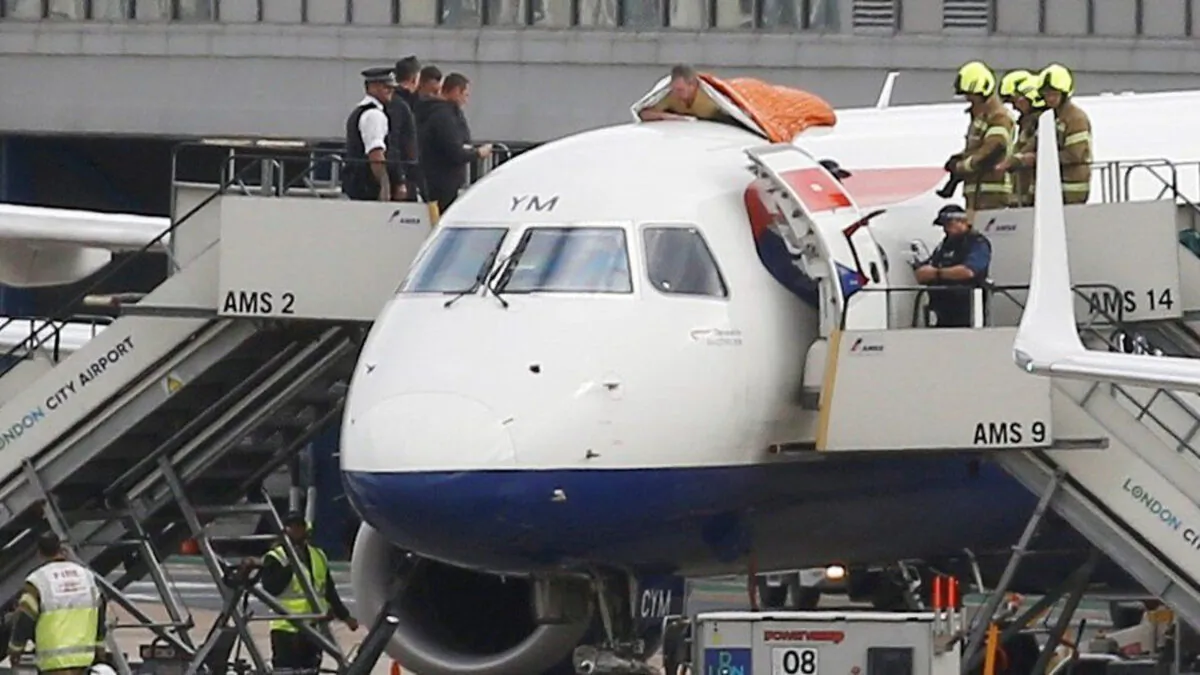 James Brown, 56, on the roof of a British Airways plane during an Extinction Rebellion protest, in the London City Airport, on Oct. 10, 2019. (Extinction Rebellion/PA)