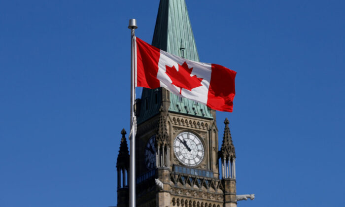 A Canadian flag flies in front of the Peace Tower on Parliament Hill in Ottawa, in a file photo. (Reuters/Chris Wattie/File photo)