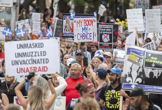 People attend a protest against the Quebec government’s measures to help curb the spread of COVID-19 in Montreal on Sept. 5. (The Canadian Press/Graham Hughes)