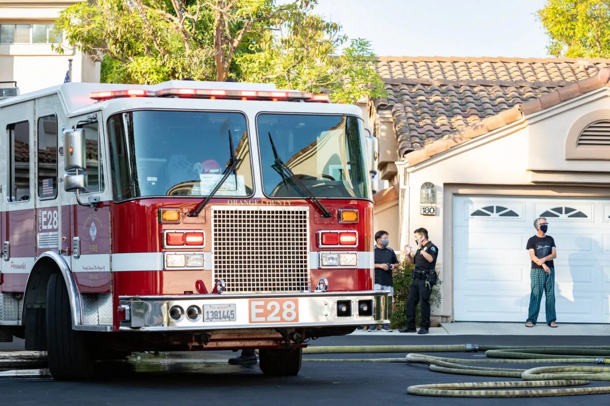 Orange County Firefighters responded to a car fire in Irvine Calif., on Aug. 17, 2020. (John Fredricks/The Epoch Times)
