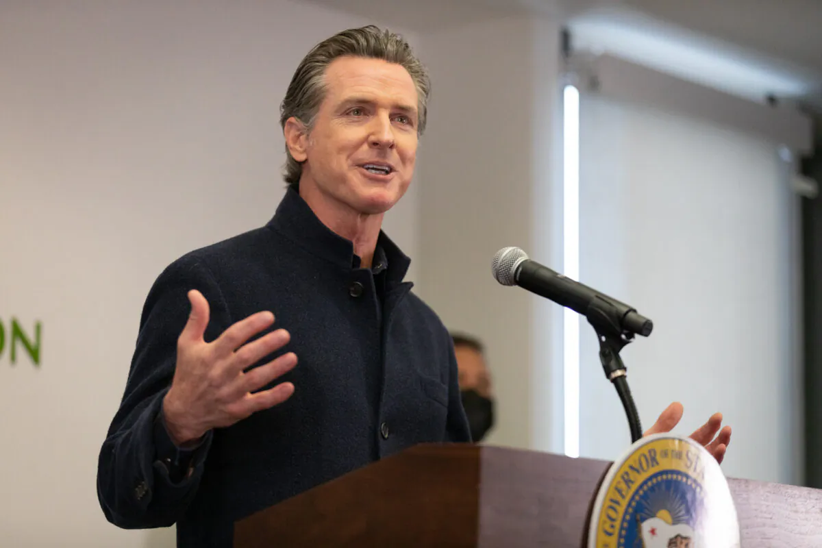California Gov. Gavin Newsom speaks to reporters at AltaMed Urgent Care in Santa Ana, Calif., on March 25, 2021. (John Fredricks/The Epoch Times)