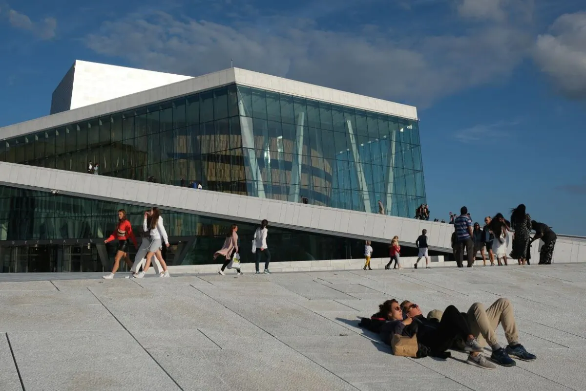 People relax outside the Oslo Opera House during the novel coronavirus pandemic in Oslo, Norway, on July 27, 2020. (Sean Gallup/Getty Images)