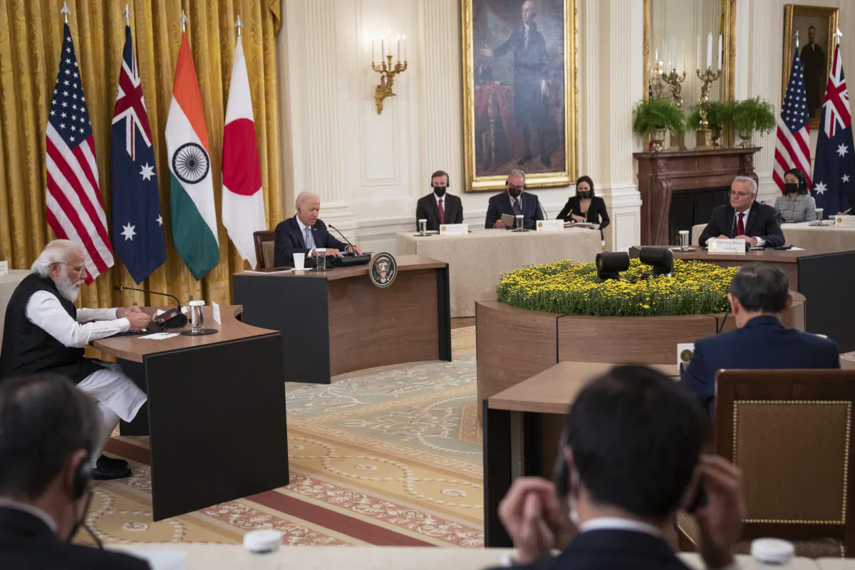 U.S. President Joe Biden (center) hosts a Quad Leaders Summit along with Indian PM Narendra Modi, Australian PM Scott Morrison, and Japanese PM Suga Yoshihide in the East Room of the White House in Washington on Sept. 24, 2021. The four leaders are expected to discuss a range of topics including a free and open Indo-Pacific ocean region. (Pool/Getty Images)