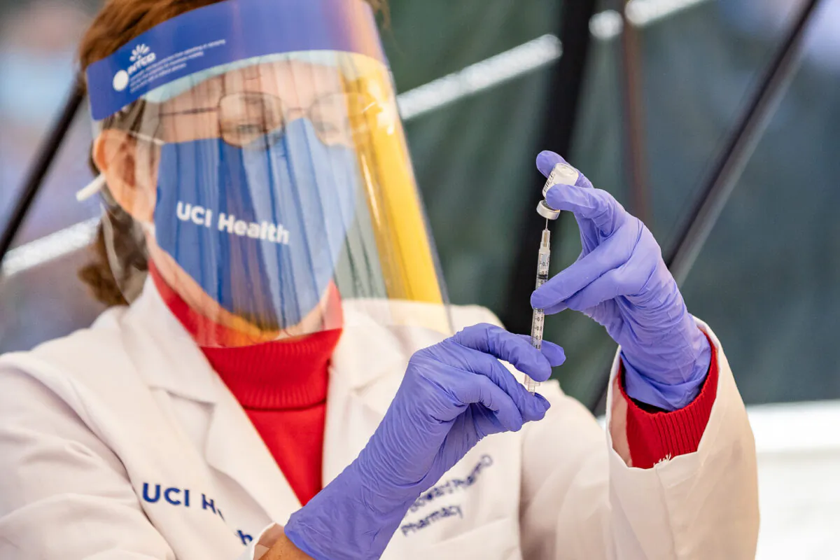 Healthcare workers at St. Joseph Hospital in Orange, Calif., on Dec. 16, 2020. (John Fredricks/The Epoch Times)