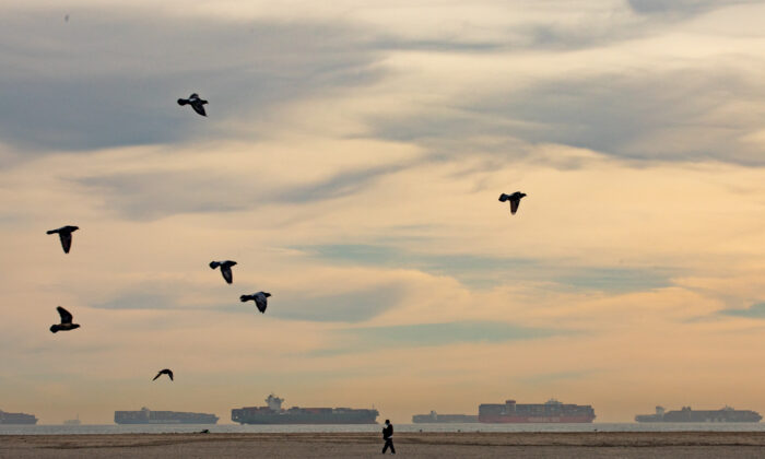 Ships line the horizon seen from Seal Beach, Calif., as they await to come ashore to  Port of Los Angeles, on Jan. 12, 2021. (John Fredricks/  Pezou)