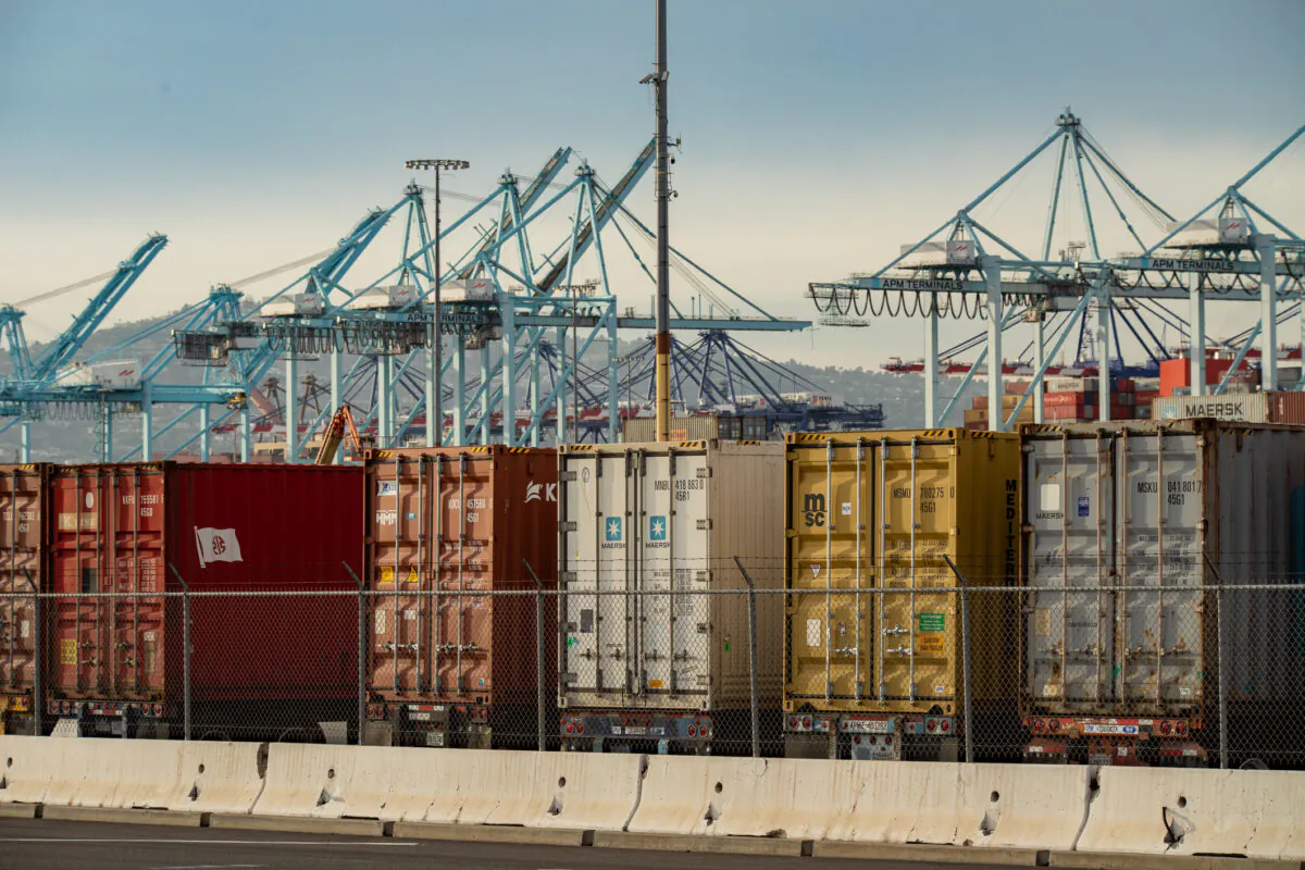 Shipping containers are loaded onto trucks at the Port of Los Angeles, Calif., on Jan. 12, 2021. (John Fredricks/The Epoch Times)