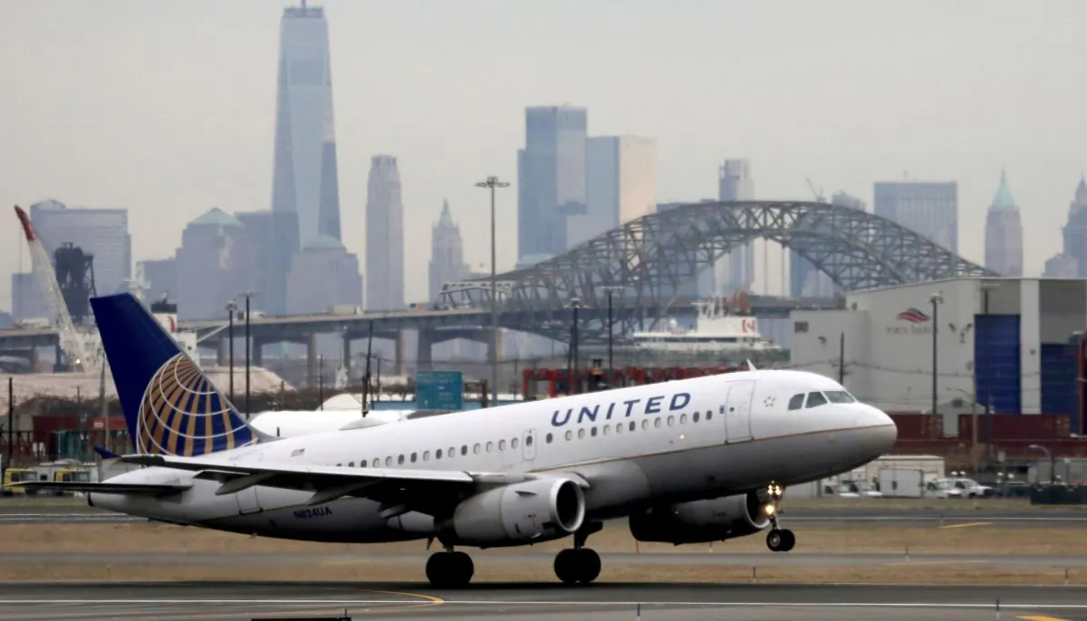 A United Airlines passenger jet takes off with New York City as a backdrop, at Newark Liberty International Airport in New Jersey on Dec. 6, 2019. (Chris Helgren/Reuters)
